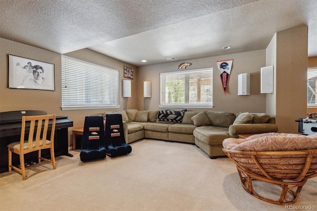 living room featuring light carpet and a textured ceiling