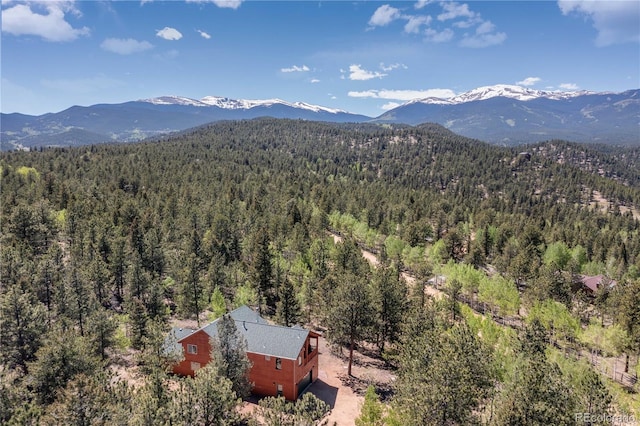 bird's eye view with a wooded view and a mountain view