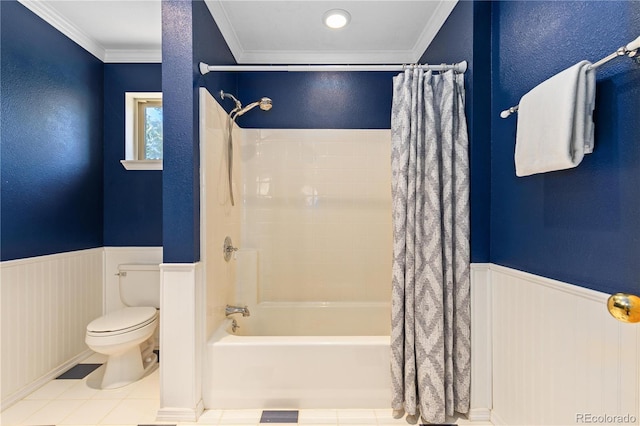 full bathroom with a wainscoted wall, ornamental molding, shower / bath combo, and toilet