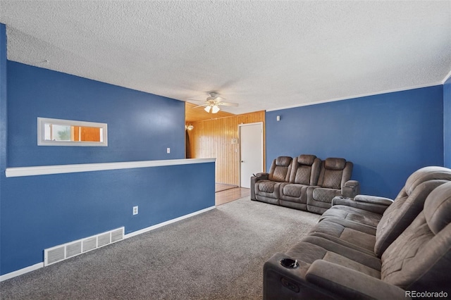 6545 Brook Forest Dr, Colorado Springs, CO 80911 - living room with ceiling fan, carpet flooring, and a textured ceiling