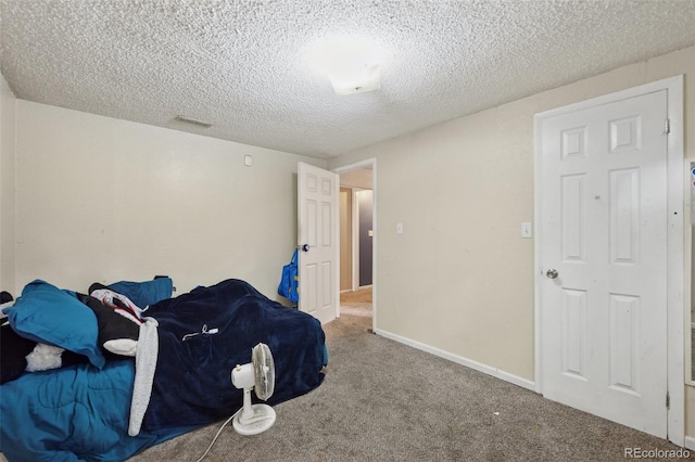 6545 Brook Forest Dr, Colorado Springs, CO 80911 - unfurnished bedroom with carpet floors and a textured ceiling