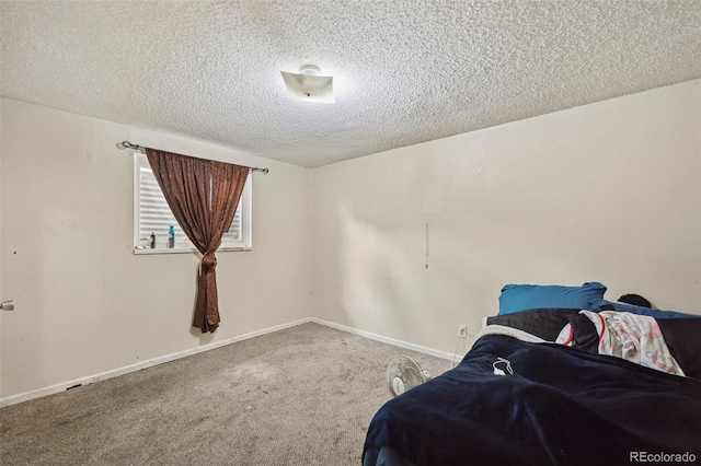 6545 Brook Forest Dr, Colorado Springs, CO 80911 - bedroom featuring a textured ceiling and carpet flooring
