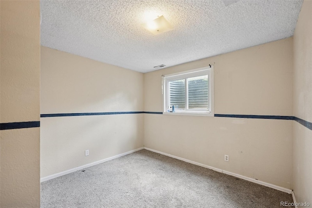6545 Brook Forest Dr, Colorado Springs, CO 80911 - unfurnished room with carpet floors and a textured ceiling