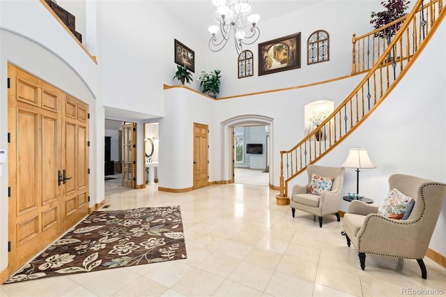 entrance foyer featuring an inviting chandelier and light tile patterned floors