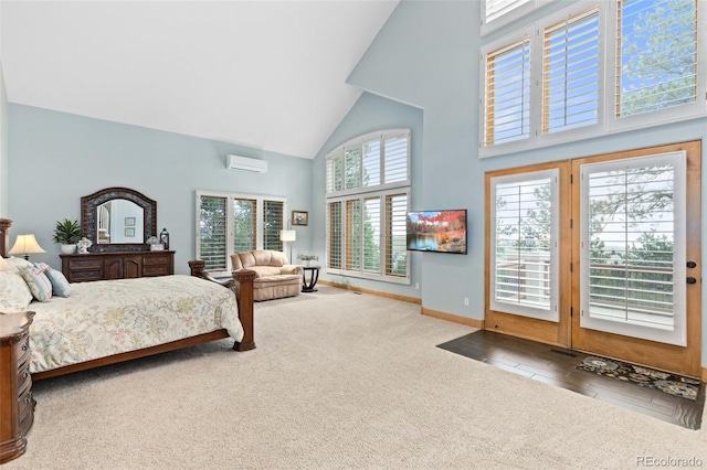 bedroom featuring a wall mounted air conditioner, high vaulted ceiling, access to outside, and carpet floors