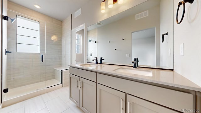 6799 Navajo St, Denver, CO 80221 - full bath with double vanity, tile patterned flooring, a shower stall, and recessed lighting