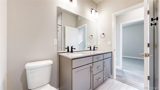6799 Navajo St, Denver, CO 80221 - bathroom featuring double vanity and toilet