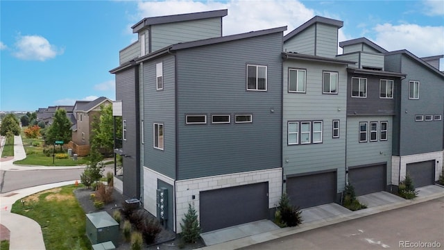 6799 Navajo St, Denver, CO 80221 - view of home's exterior featuring an attached garage