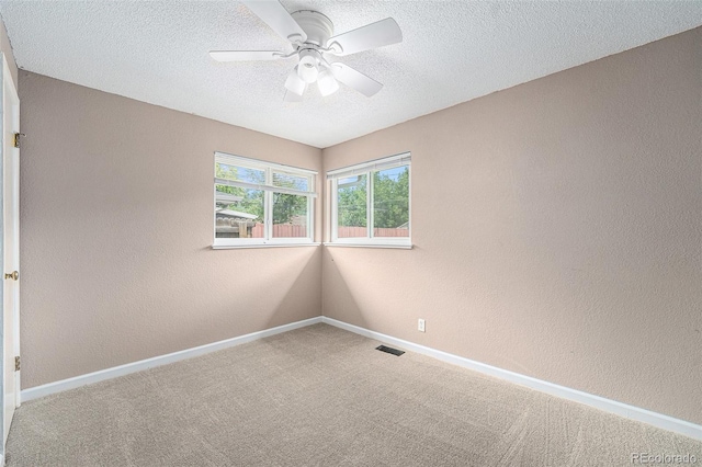 2308 Lima St, Aurora, CO 80010 - carpeted spare room with ceiling fan, a textured wall, and a textured ceiling