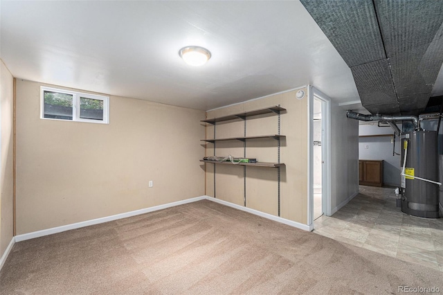 2308 Lima St, Aurora, CO 80010 - basement featuring gas water heater and carpet flooring