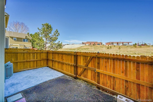 view of patio / terrace featuring fence