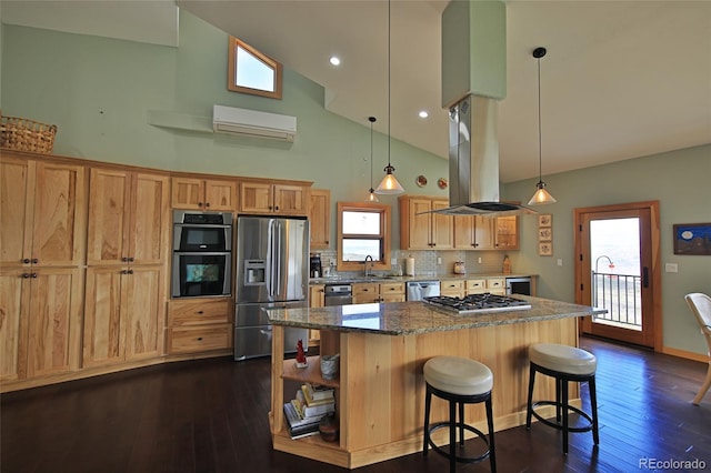 53315 Bull Basin Rd, Mesa, CO 81643 - kitchen featuring stainless steel appliances, high vaulted ceiling, island exhaust hood, an AC wall unit, and a center island
