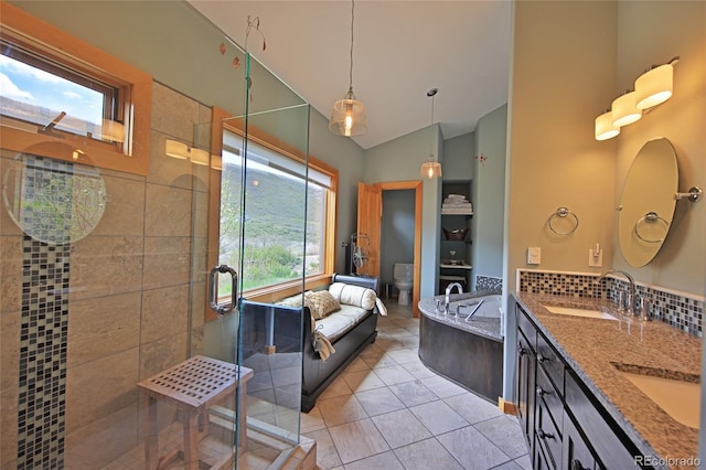 53315 Bull Basin Rd, Mesa, CO 81643 - bathroom with a stall shower, lofted ceiling, tile patterned flooring, toilet, and double vanity