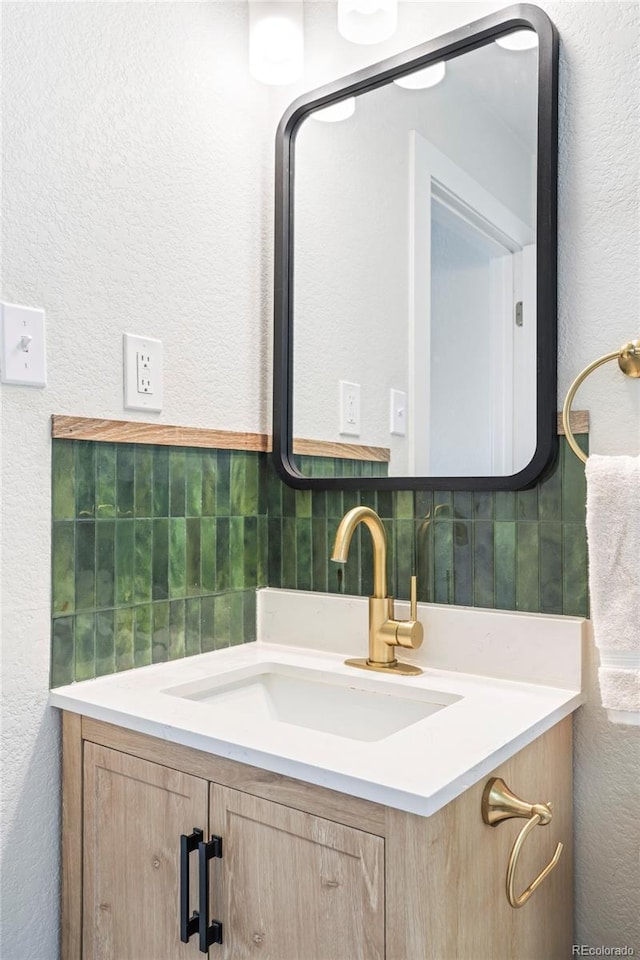 1749 Havana St, Aurora, CO 80010 - bathroom with vanity and a textured wall