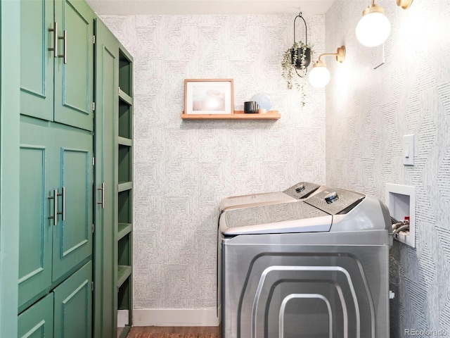 1749 Havana St, Aurora, CO 80010 - laundry room with washer and dryer, cabinet space, baseboards, and wallpapered walls