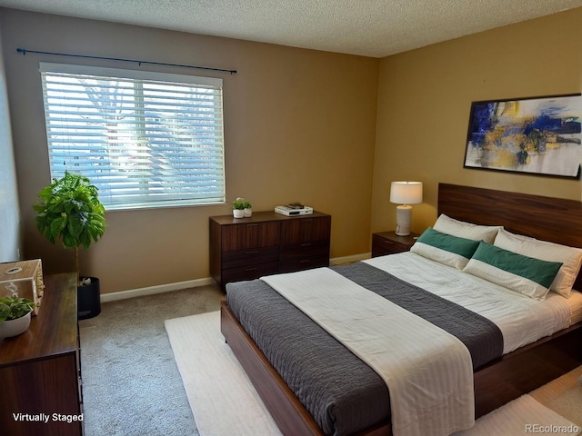 carpeted bedroom featuring baseboards