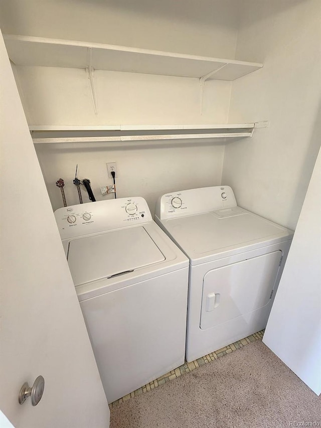 washroom with separate washer and dryer and laundry area