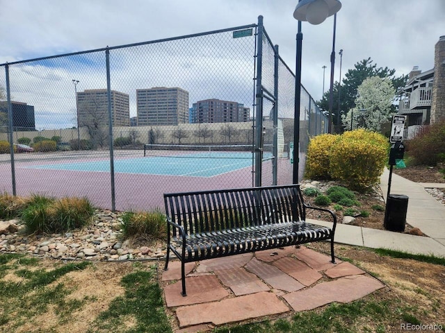 view of tennis court with fence