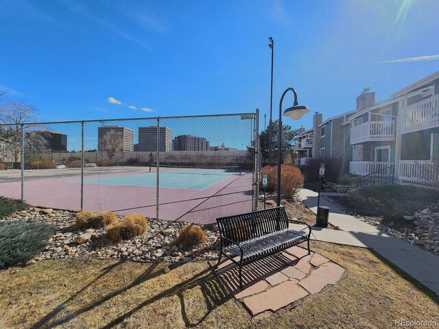view of tennis court with fence