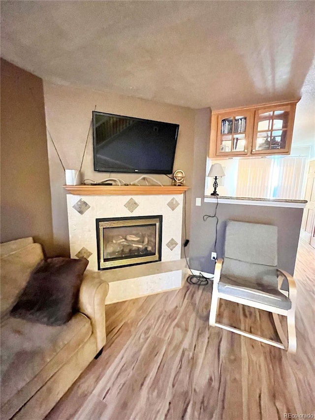 sitting room with hardwood / wood-style flooring