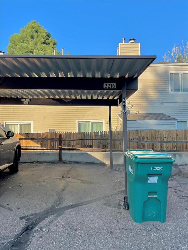 view of vehicle parking with a carport