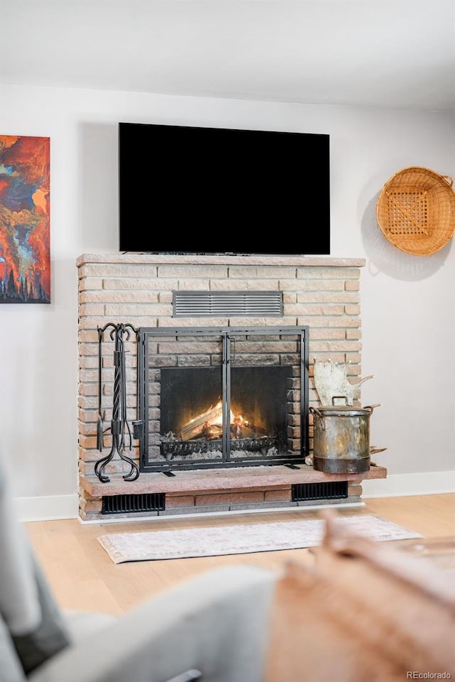 room details featuring a fireplace and baseboards