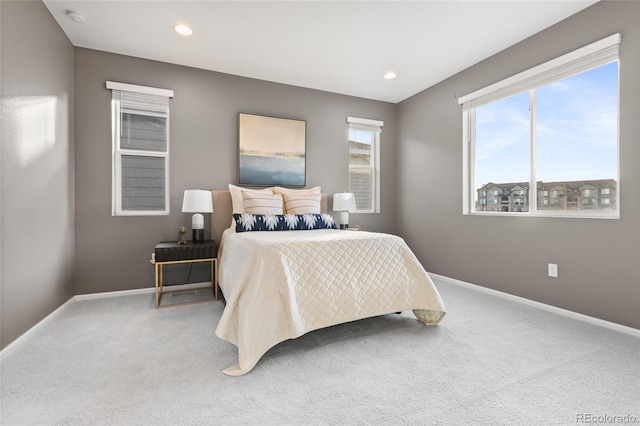 bedroom with carpet floors, baseboards, and recessed lighting