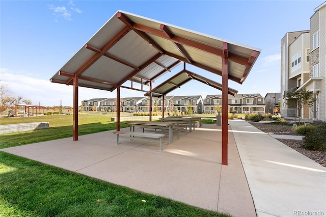 view of home's community featuring a residential view and a lawn