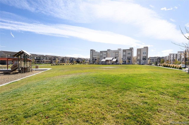 view of yard featuring playground community and a residential view