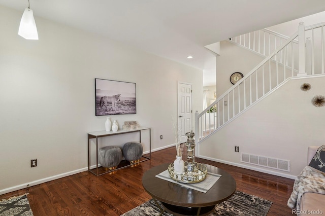 16164 E Hinsdale Ave, Aurora, CO 80016 - living area featuring baseboards, stairs, wood finished floors, and visible vents