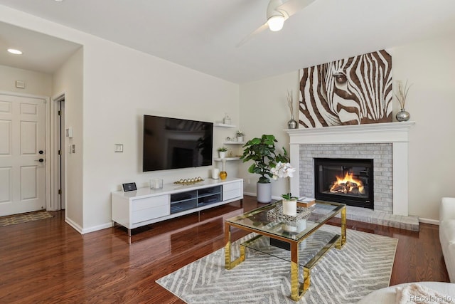 16164 E Hinsdale Ave, Aurora, CO 80016 - living room with wood finished floors, a fireplace, baseboards, recessed lighting, and a ceiling fan