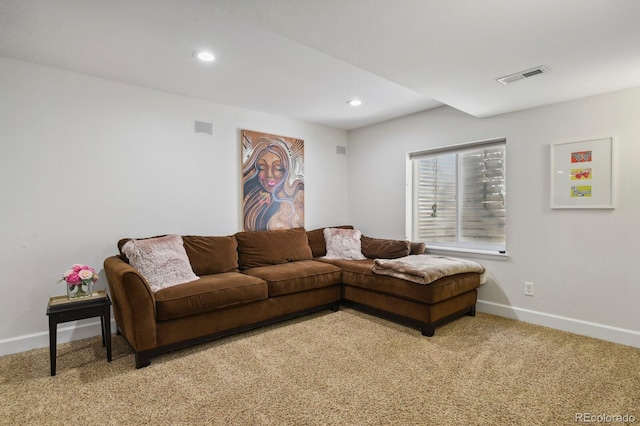 16164 E Hinsdale Ave, Aurora, CO 80016 - living area featuring baseboards, light carpet, and visible vents