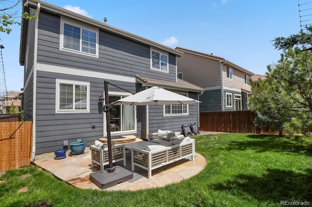 16164 E Hinsdale Ave, Aurora, CO 80016 - rear view of property featuring a lawn, outdoor lounge area, a fenced backyard, and a patio area