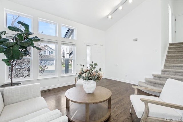 3974 Cambridge Ave, Broomfield, CO 80020 - living area with high vaulted ceiling, track lighting, wood finished floors, and stairs
