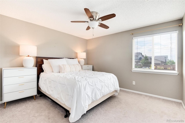 bedroom featuring ceiling fan and light colored carpet