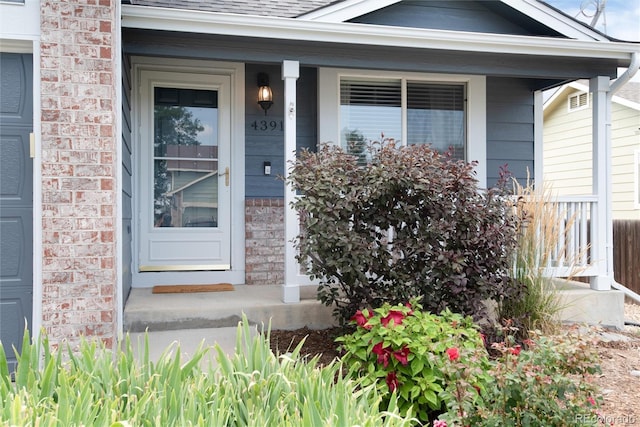 property entrance with covered porch