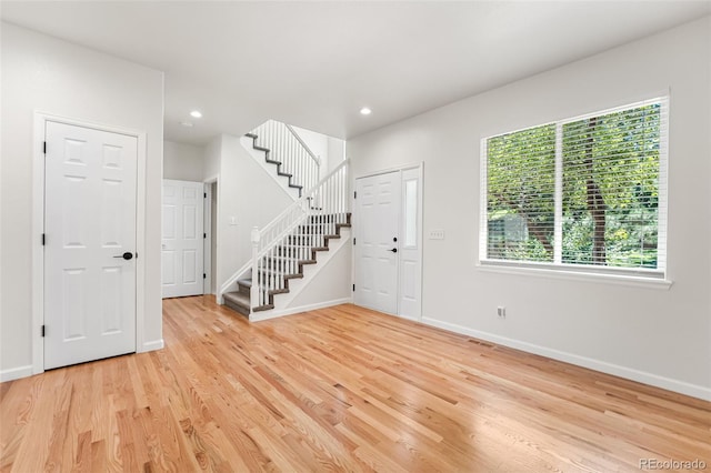 7600 W Coal Mine Ave Unit B, Littleton, CO 80123 - entrance foyer with stairs, light wood finished floors, and recessed lighting