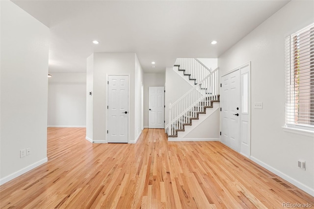 7600 W Coal Mine Ave Unit B, Littleton, CO 80123 - entryway featuring light wood-style floors, stairs, and recessed lighting