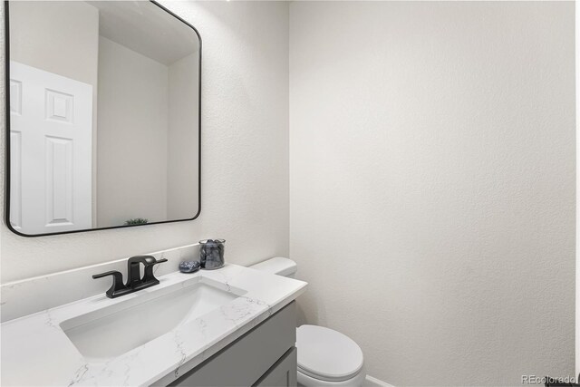 7600 W Coal Mine Ave Unit B, Littleton, CO 80123 - bathroom featuring vanity and toilet