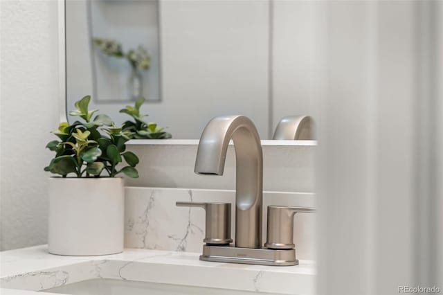 7600 W Coal Mine Ave Unit B, Littleton, CO 80123 - bathroom view of tasteful backsplash and a sink