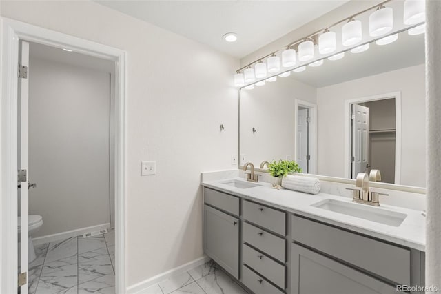 7600 W Coal Mine Ave Unit B, Littleton, CO 80123 - bathroom featuring marble look tiles and double vanity