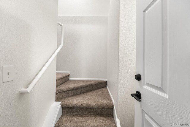 7600 W Coal Mine Ave Unit B, Littleton, CO 80123 - stairs with carpet and a textured wall