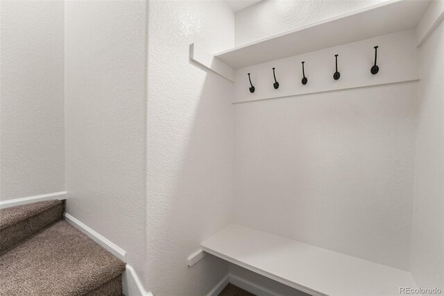 7600 W Coal Mine Ave Unit B, Littleton, CO 80123 - mudroom with a textured wall and carpet