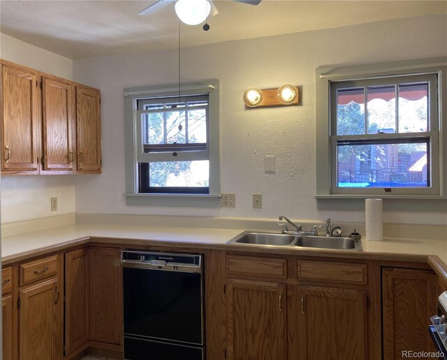 136 Cave Ave, Manitou Springs, CO 80829 - kitchen with black dishwasher, healthy amount of natural light, and light countertops