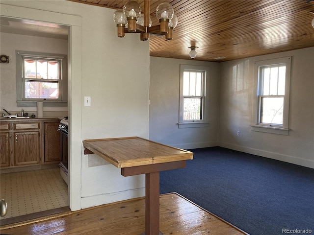 136 Cave Ave, Manitou Springs, CO 80829 - unfurnished dining area featuring wood ceiling and a chandelier