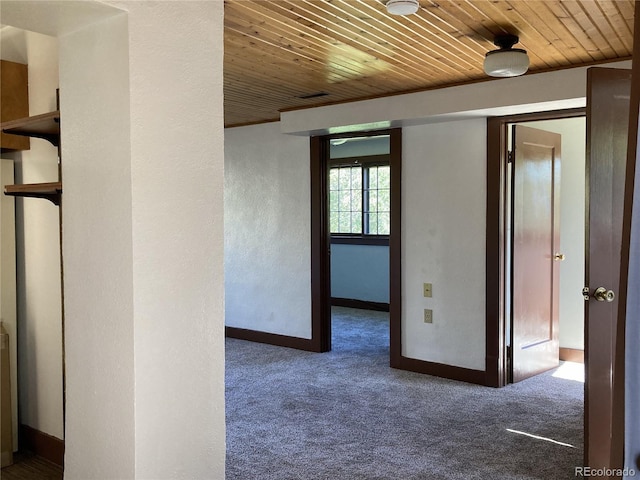 136 Cave Ave, Manitou Springs, CO 80829 - hall featuring wooden ceiling, carpet floors, and a textured wall