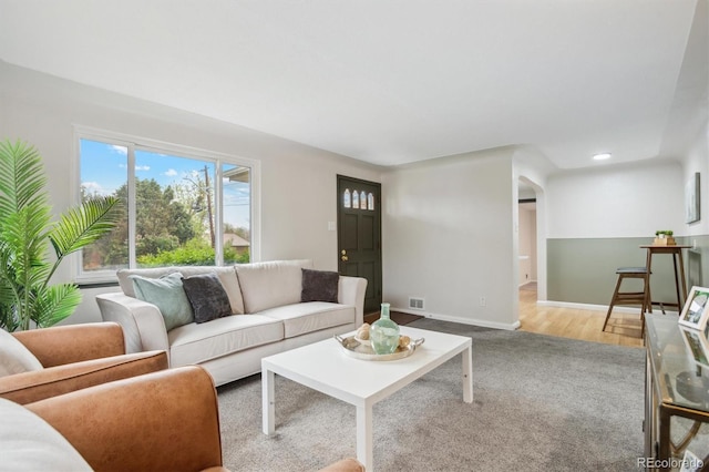carpeted living room with baseboards and recessed lighting