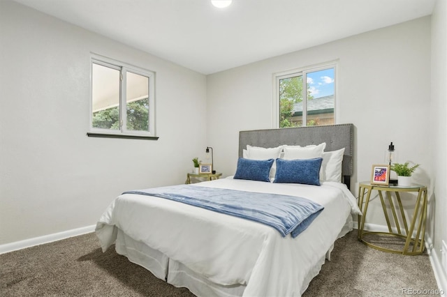 bedroom with carpet and baseboards