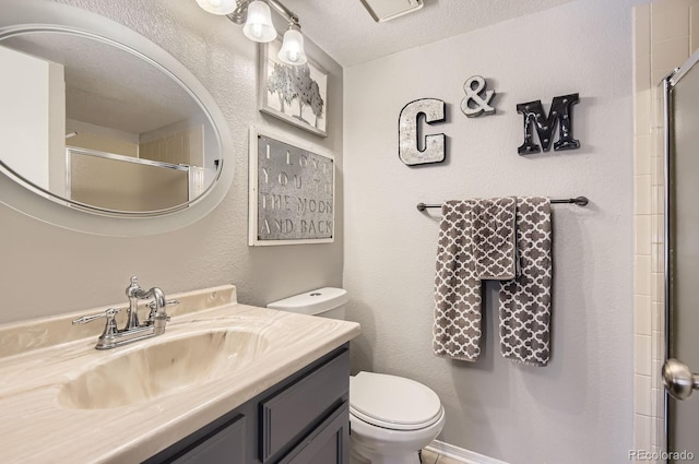 2890 W Long Cir Unit A, Littleton, CO 80120 - bathroom featuring vanity, an enclosed shower, and a textured ceiling