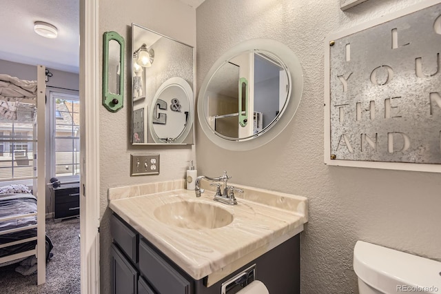 2890 W Long Cir Unit A, Littleton, CO 80120 - bathroom featuring a textured wall and vanity